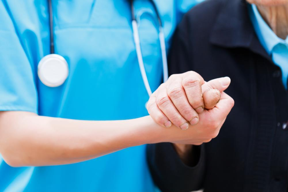 Nurse helping aged care patient
